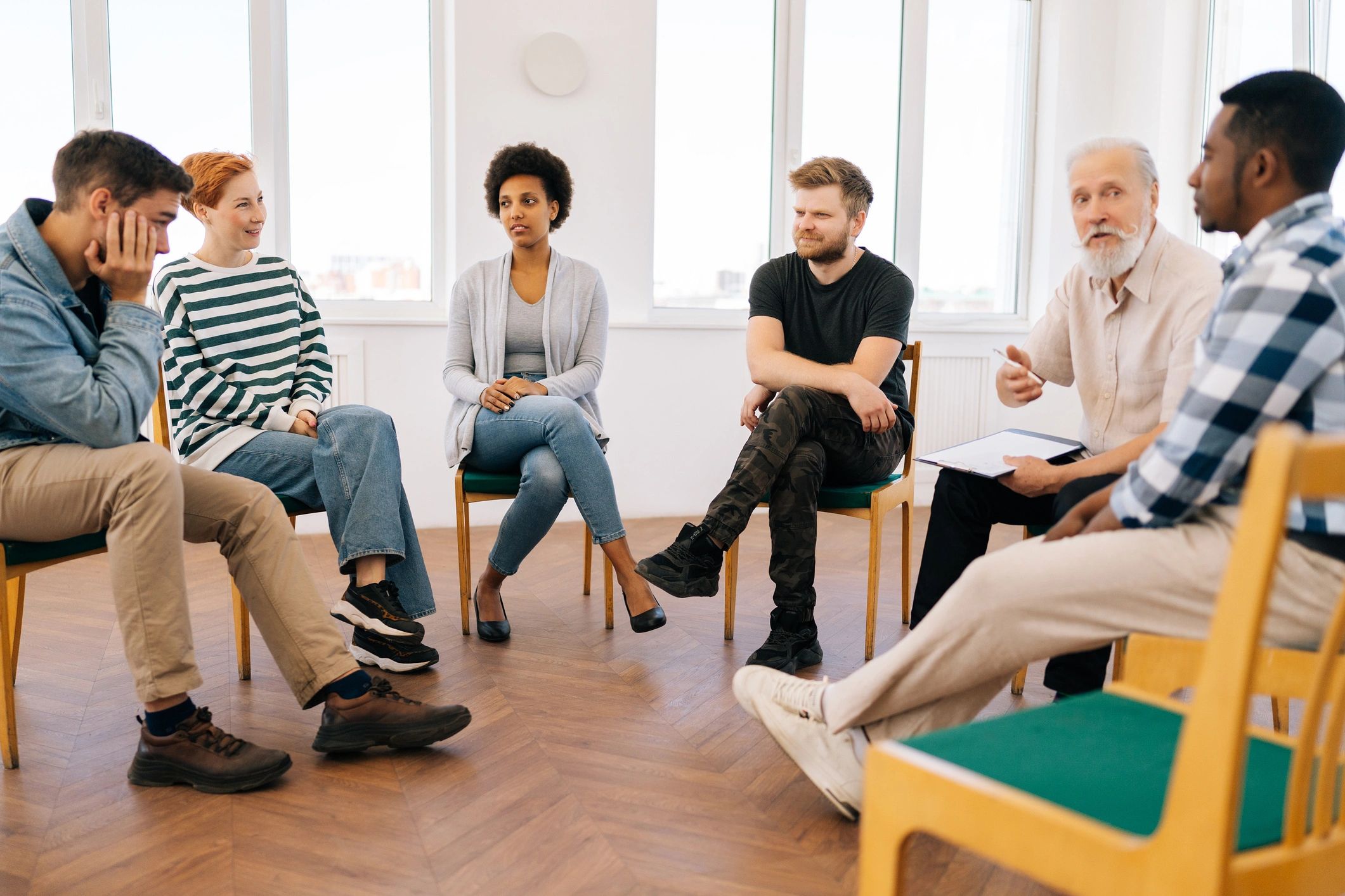 Adults taking part in a supportive wellbeing session